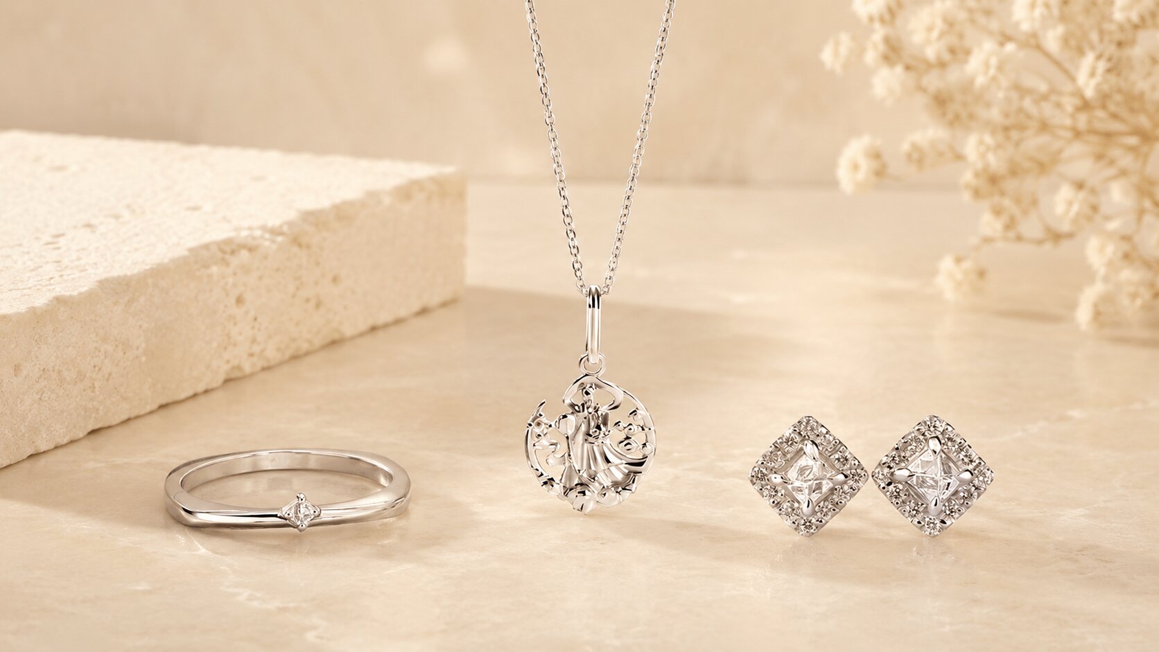 Guardian Diamond Square Ring, Jintao Xiannu Necklace, and Mini Pyra Earrings displayed together on a warm stone surface.